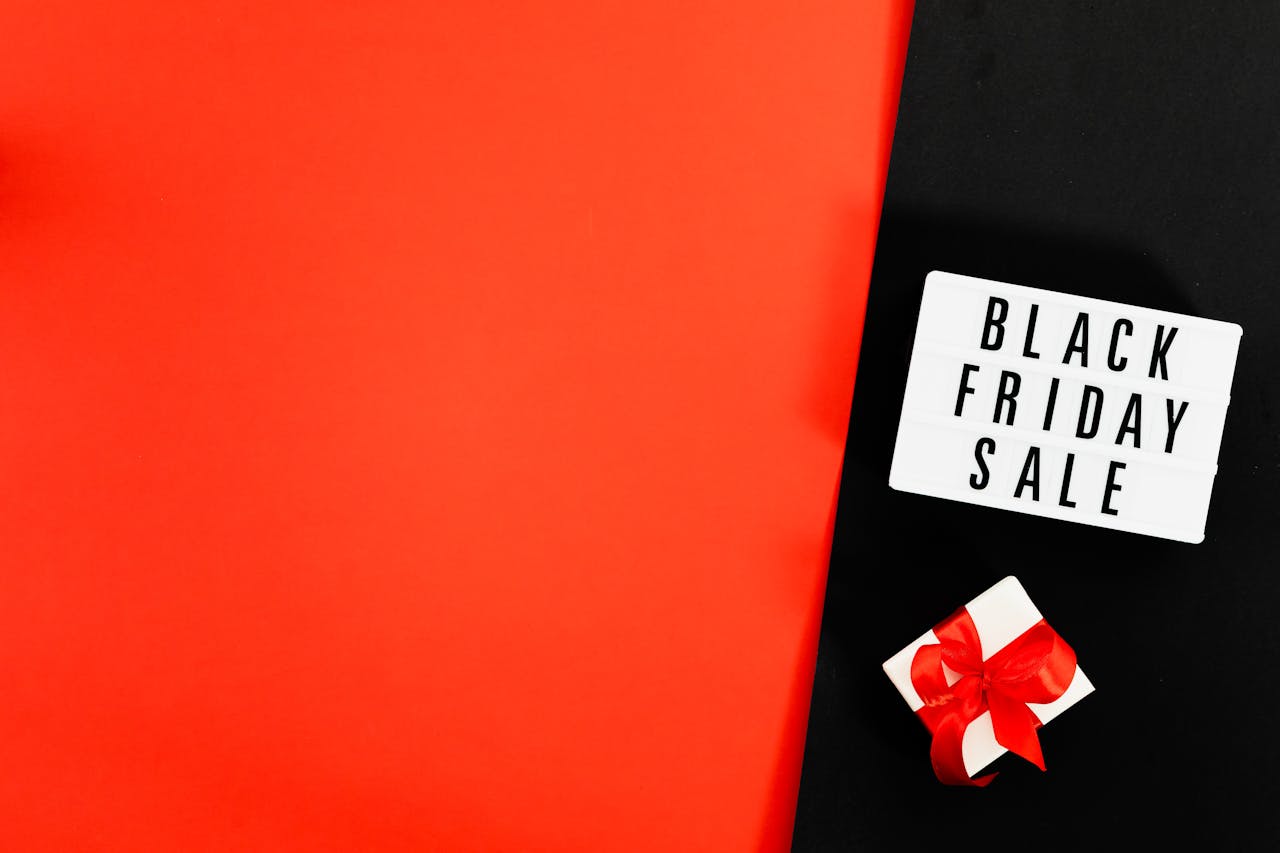 Minimalist Black Friday sale image with gift box and copy space.
